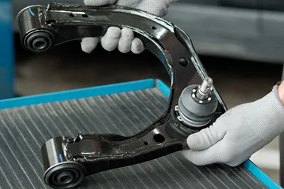 Cómo identificar un fabricante de brazos de control de confianza